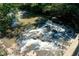Cascading water feature over rocks in a creek setting at 164 Oxbo Rd, Roswell, GA 30075