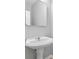 Clean bathroom featuring a pedestal sink with a modern mirror at 129 Prospect Path, Hiram, GA 30141