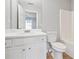 A white bathroom with white cabinets, a white toilet, and a shower/tub combo at 129 Prospect Path, Hiram, GA 30141