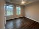 Bedroom featuring hard wood flooring and two large windows at 1313 Breezy Street # 131, Atlanta, GA 30315