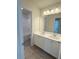 This bathroom features double sinks, white cabinets, and a shower/tub combo at 1847 Kingsmere Run Dr, Loganville, GA 30052