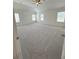 Expansive bedroom features plush carpeting and a ceiling fan for added comfort at 1847 Kingsmere Run Dr, Loganville, GA 30052