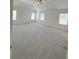 A large bedroom that boasts a vaulted ceiling, neutral walls, and plush carpeting at 1847 Kingsmere Run Dr, Loganville, GA 30052