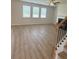 Spacious living room with fireplace, ceiling fan, and multiple windows at 1847 Kingsmere Run Dr, Loganville, GA 30052