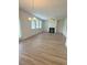 Open-concept living area with a fireplace and access to the backyard at 1847 Kingsmere Run Dr, Loganville, GA 30052