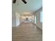 Bright living area flows into the kitchen, featuring wood-look floors and natural light at 1847 Kingsmere Run Dr, Loganville, GA 30052