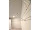 Spacious walk-in closet featuring ample shelving for optimal organization and storage solutions at 1847 Kingsmere Run Dr, Loganville, GA 30052