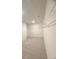 Large walk-in closet with generous carpeted floor space and ample built-in shelving at 1847 Kingsmere Run Dr, Loganville, GA 30052