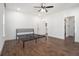 Bright bedroom with hardwood floors, ceiling fan, and minimal bed frame at 2265 Perkerson Sw Rd, Atlanta, GA 30315