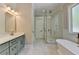 Bathroom with double vanity, glass shower, and soaking tub at 270 New Hope Rd, Lawrenceville, GA 30046
