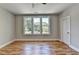 Bright bedroom featuring hardwood flooring, neutral walls, and large windows at 270 New Hope Rd, Lawrenceville, GA 30046