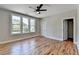 Bedroom featuring hardwood flooring, neutral walls, ceiling fan and large windows at 270 New Hope Rd, Lawrenceville, GA 30046