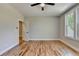 Bedroom featuring hardwood flooring, neutral walls, ceiling fan and large windows at 270 New Hope Rd, Lawrenceville, GA 30046