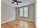 Well-lit bedroom featuring beautiful hardwood floors and a modern ceiling fan at 270 New Hope Rd, Lawrenceville, GA 30046