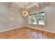 Bright dining room boasts wood floors, modern light fixture, and decorative wall and ceiling trim at 270 New Hope Rd, Lawrenceville, GA 30046