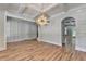 Dining room featuring wood floors, a decorative trim wall and ceiling, and view of the stairway at 270 New Hope Rd, Lawrenceville, GA 30046