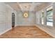 Elegant dining room featuring hardwood floors, coffered ceiling, and designer lighting at 270 New Hope Rd, Lawrenceville, GA 30046