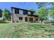 Exterior elevation of the home featuring covered patio, large windows, and a well-maintained lawn at 270 New Hope Rd, Lawrenceville, GA 30046