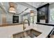 Bright kitchen with a large island, stainless steel sink, and view into the living area at 270 New Hope Rd, Lawrenceville, GA 30046