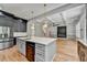 Open kitchen with white island, dark cabinets, stainless steel appliances, and an open floor plan at 270 New Hope Rd, Lawrenceville, GA 30046