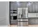 Kitchen featuring stainless steel refrigerator, oven, and modern cabinets at 270 New Hope Rd, Lawrenceville, GA 30046