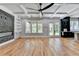 Bright living room with hardwood floors, coffered ceilings, fireplace, and large windows at 270 New Hope Rd, Lawrenceville, GA 30046