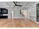 Open-concept living area with hardwood floors, fireplace, coffered ceilings, and staircase at 270 New Hope Rd, Lawrenceville, GA 30046