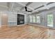Bright living room with hardwood floors, coffered ceilings, built in shelving, and fireplace at 270 New Hope Rd, Lawrenceville, GA 30046