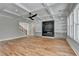 Bright living room with hardwood floors, coffered ceilings, built in shelving, and fireplace at 270 New Hope Rd, Lawrenceville, GA 30046