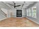 Bright living room with hardwood floors, coffered ceilings, built in shelving, and fireplace at 270 New Hope Rd, Lawrenceville, GA 30046