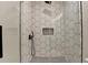 A beautifully tiled shower with black fixtures, accents, and glass surround at 270 New Hope Rd, Lawrenceville, GA 30046