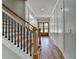 Stairway features wood floors, white risers, black iron balusters, and wooden handrail at 270 New Hope Rd, Lawrenceville, GA 30046