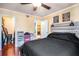 Cozy bedroom featuring wood floors, ceiling fan, closet, and natural light at 3175 Seven Pines Ct # 207, Atlanta, GA 30339