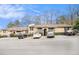 Low-rise apartments with ample parking, brick accents, and manicured landscaping offer a serene community setting at 3175 Seven Pines Ct # 207, Atlanta, GA 30339