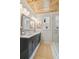 Well-lit bathroom with double vanity, marble countertops, and a glass-enclosed shower at 106 Cottage Gate Ln, Roswell, GA 30076