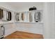 Walk-in closet with ample shelving and hanging space at 106 Cottage Gate Ln, Roswell, GA 30076
