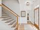 Bright entryway featuring hardwood floors, a staircase, and natural light from the front door at 106 Cottage Gate Ln, Roswell, GA 30076