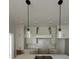 Beautiful white kitchen featuring modern lighting and white subway tile backsplash at 106 Cottage Gate Ln, Roswell, GA 30076