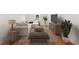 Cozy living room features a comfortable sectional sofa, entertainment center, and stylish decor at 106 Cottage Gate Ln, Roswell, GA 30076