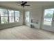 Bright living room with large windows to let in the natural light and provide nice views at 106 Cottage Gate Ln, Roswell, GA 30076