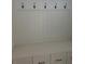 Mudroom with coat hooks and storage cabinets. Great for organization at 106 Cottage Gate Ln, Roswell, GA 30076