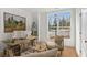 Home office with a view, featuring a large window and comfortable seating arrangement at 106 Cottage Gate Ln, Roswell, GA 30076