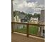 Great view from the porch of a beautiful neighborhood with green grass and landscaping at 106 Cottage Gate Ln, Roswell, GA 30076