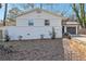 Home exterior showing a tidy lawn, brick facade, and one car garage at 1392 Shoreham Dr, Atlanta, GA 30349