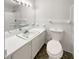 Clean bathroom featuring a vanity, mirror, toilet, and shower-tub combo at 1665 Ridgeview Nw Dr, Conyers, GA 30012