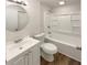 Neat bathroom features a vanity, mirror, toilet, and a clean shower-tub combo at 1665 Ridgeview Nw Dr, Conyers, GA 30012