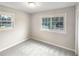 This bright bedroom features carpet and a window with a view of the neighborhood at 1665 Ridgeview Nw Dr, Conyers, GA 30012