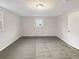 This bright bedroom features carpet and a window at 1665 Ridgeview Nw Dr, Conyers, GA 30012