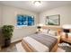 Cozy bedroom features a large window with a view, a plush bed, and stylish bedside tables with lamps at 1665 Ridgeview Nw Dr, Conyers, GA 30012
