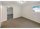 This bedroom features carpet and a doorway to another room at 1665 Ridgeview Nw Dr, Conyers, GA 30012